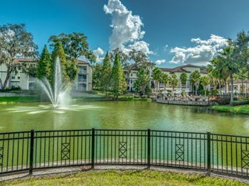 Pond and fountain with building exteriors in the background